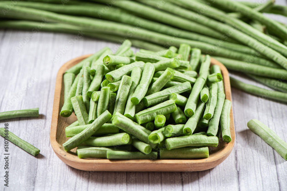 slice of long bean or cowpea in a plate on table slice of long bean or cowpea in a plate on table