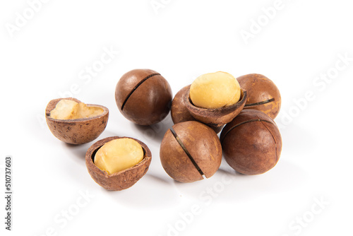 Shelled and unshelled macadamia nuts isolated on white background