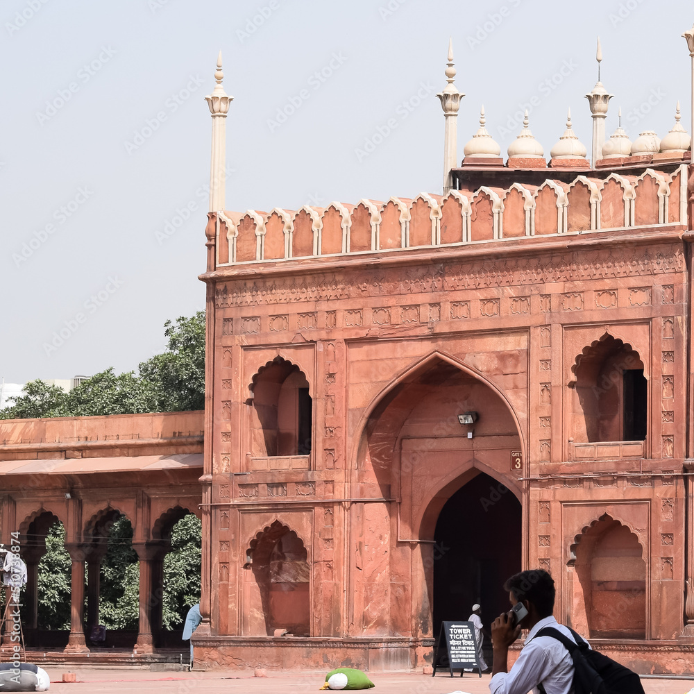 Unidentified Indian tourists visiting Jama Masjid during Ramzan season, in Delhi 6, India. Jama Masjid is the largest and perhaps the most magnificent mosque in India