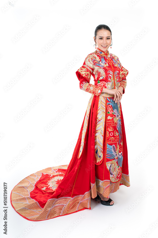 Portrait of a young asian Chinese female lady model wearing red traditional vintage wedding costume smiling and posing with different poses and gestures 