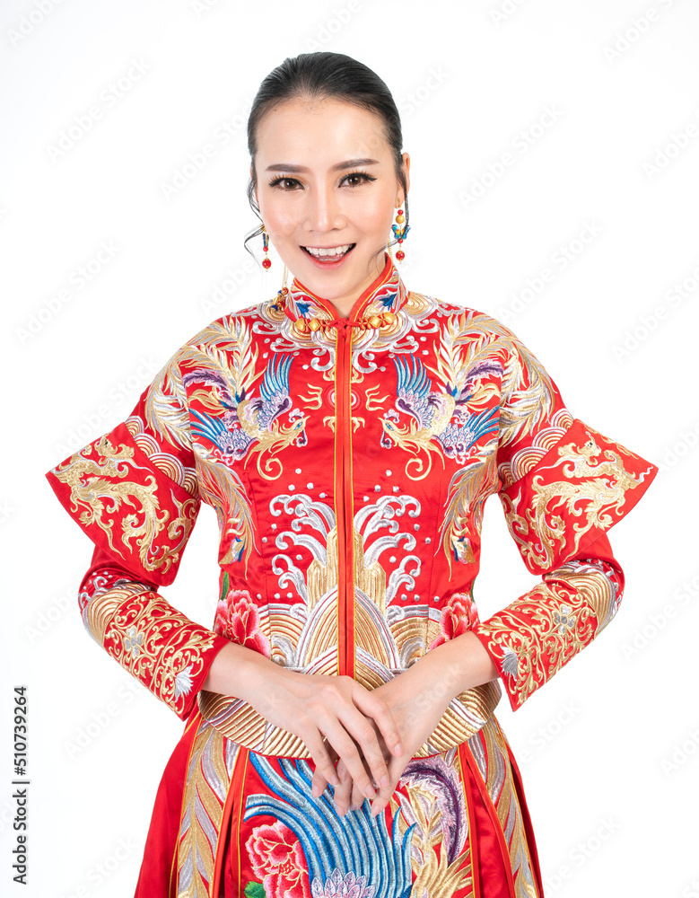 Portrait of a young asian Chinese female lady model wearing red traditional vintage wedding costume smiling and posing with different poses and gestures 