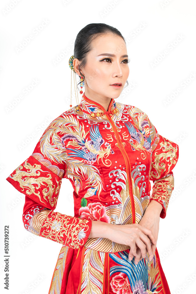 Portrait of a young asian Chinese female lady model wearing red traditional vintage wedding costume smiling and posing with different poses and gestures Portrait of a young asian Chinese female lady model wearing red traditional vintage wedding costume smiling and posing with different poses and gestures
