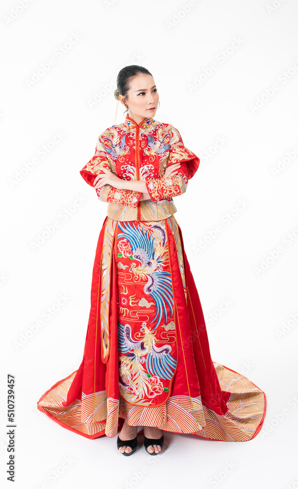 Portrait of a young asian Chinese female lady model wearing red traditional vintage wedding dress costume smiling and posing with different poses and gestures Portrait of a young asian Chinese female lady model wearing red traditional vintage wedding dress costume smiling and posing with different poses and gestures