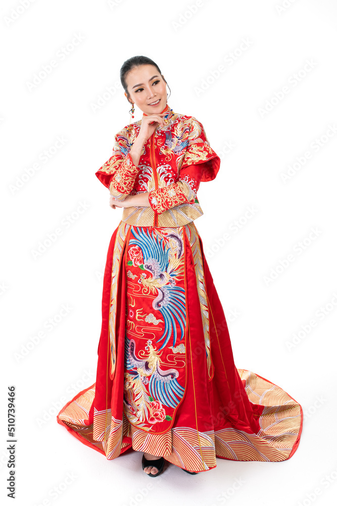 Portrait of a young asian Chinese female lady model wearing red traditional vintage wedding dress costume smiling and posing with different poses and gestures Portrait of a young asian Chinese female lady model wearing red traditional vintage wedding dress costume smiling and posing with different poses and gestures