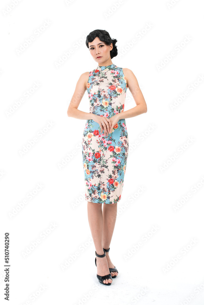 Portrait of a young asian Chinese female lady model wearing a patterned traditional vintage costume Cheongsam smiling and posing with different poses and gestures Portrait of a young asian Chinese female lady model wearing a patterned traditional vintage costume Cheongsam smiling and posing with different poses and gestures