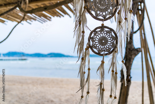 Dream catcher hanging on a tree seaside