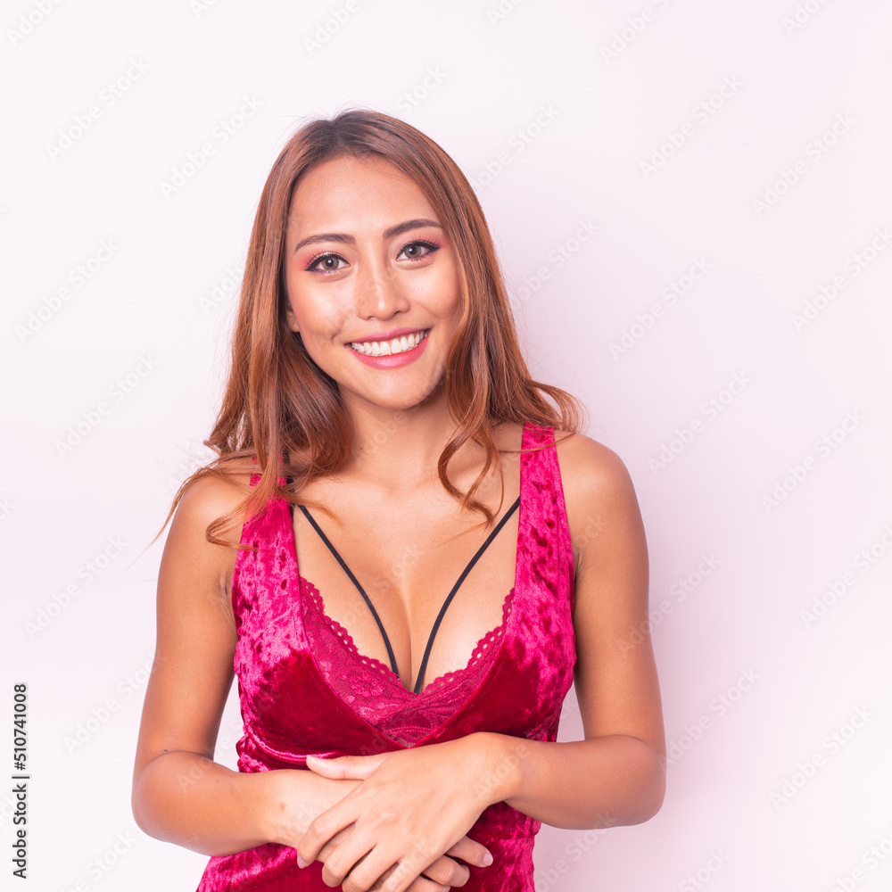 Beautiful and friendly young asian sexy female lady model wearing elegant dark pink color dress posing happily with different poses, gestures and emotions Beautiful and friendly young asian sexy female lady model wearing elegant dark pink color dress posing happily with different poses, gestures and emotions