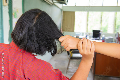 Schoolgirl pulling her friend's hair photo