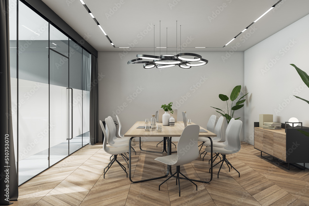Fototapeta premium Side view on sunlit meeting room interior design with stylish lamp above light wooden conference table with vases and laptops, chairs on parquet floor, grey walls and glass door. 3D rendering