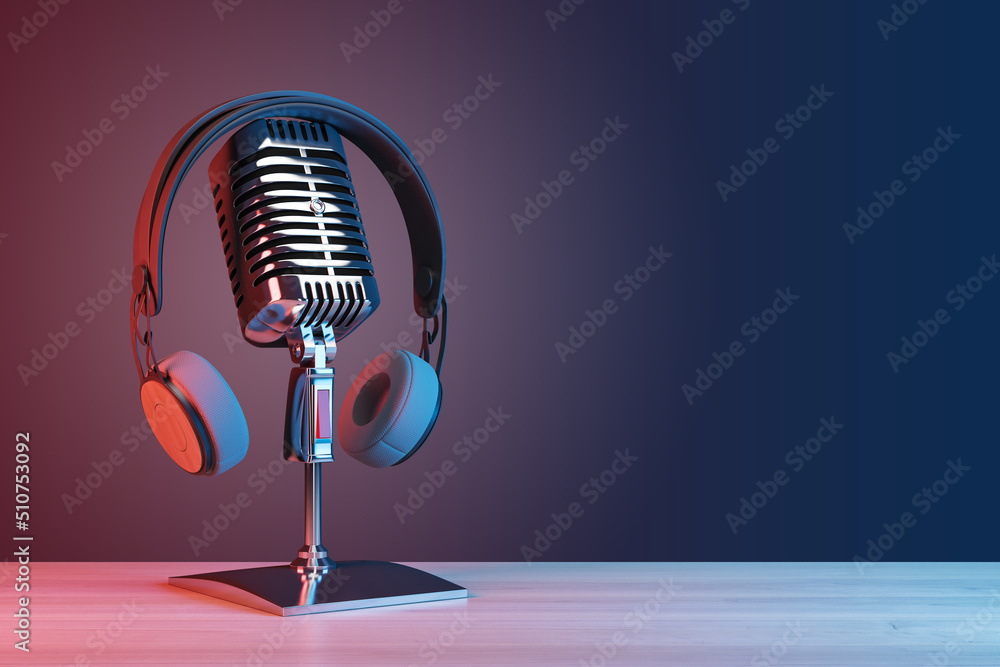 Podcasting and radio concept with retro microphone and headphones on empty wooden table and dark blank wall background with place for your logo or text. 3D rendering, mock up - obrazy, fototapety, plakaty 