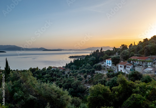 A beautiful sunrise over a village in Ithaca, Greece. © Ming