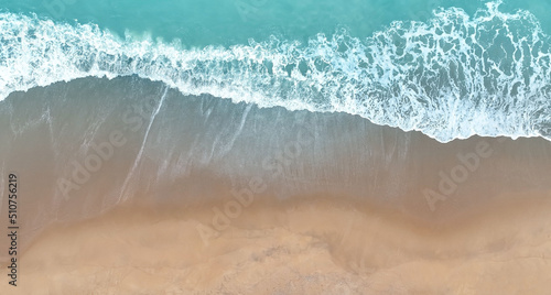 Aerial Top view of Beach sand copy space Beautiful sea waves in Summer tropical background