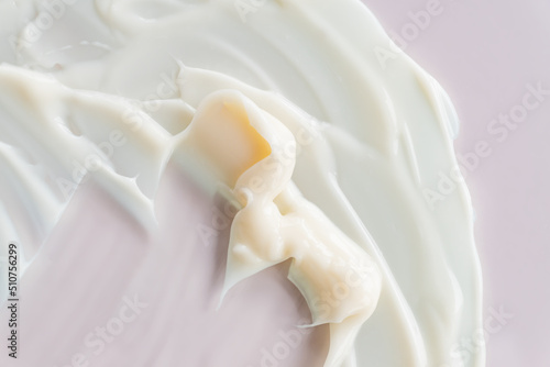 Cosmetic lotion background. Light cream smeared. Moisturizer, mask, creamy skin care product texture
