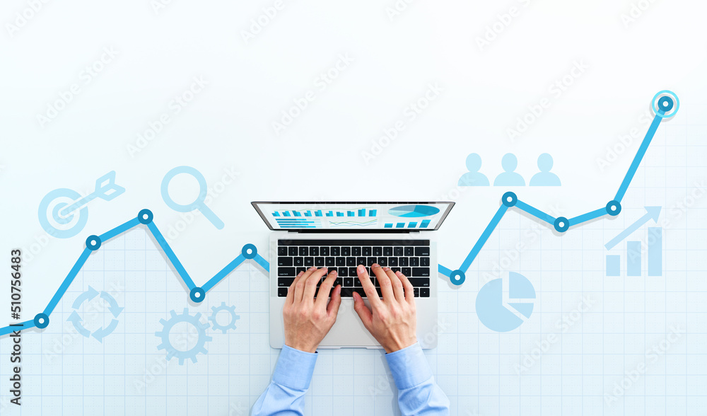 Web analytics and digital marketing. Top view of business man using laptop. Blue graphs and icons. - obrazy, fototapety, plakaty 