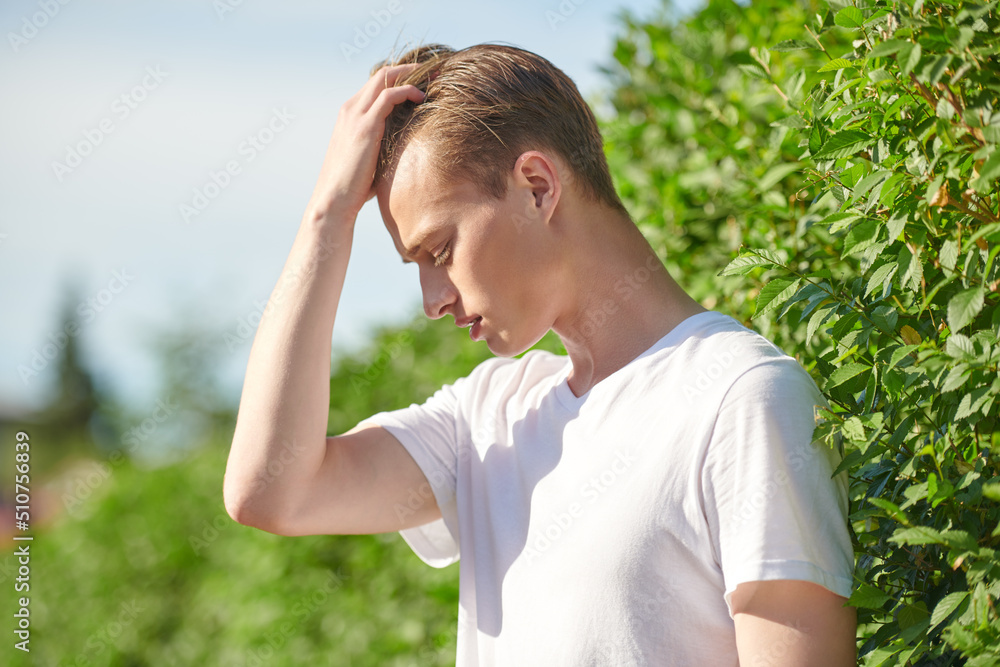sad guy standing in park sad guy standing in park