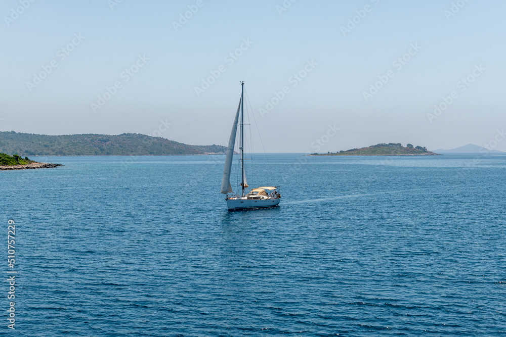 A sailing yacht on the Ionian Sea sailing the Greek islands. Sailing holidays.