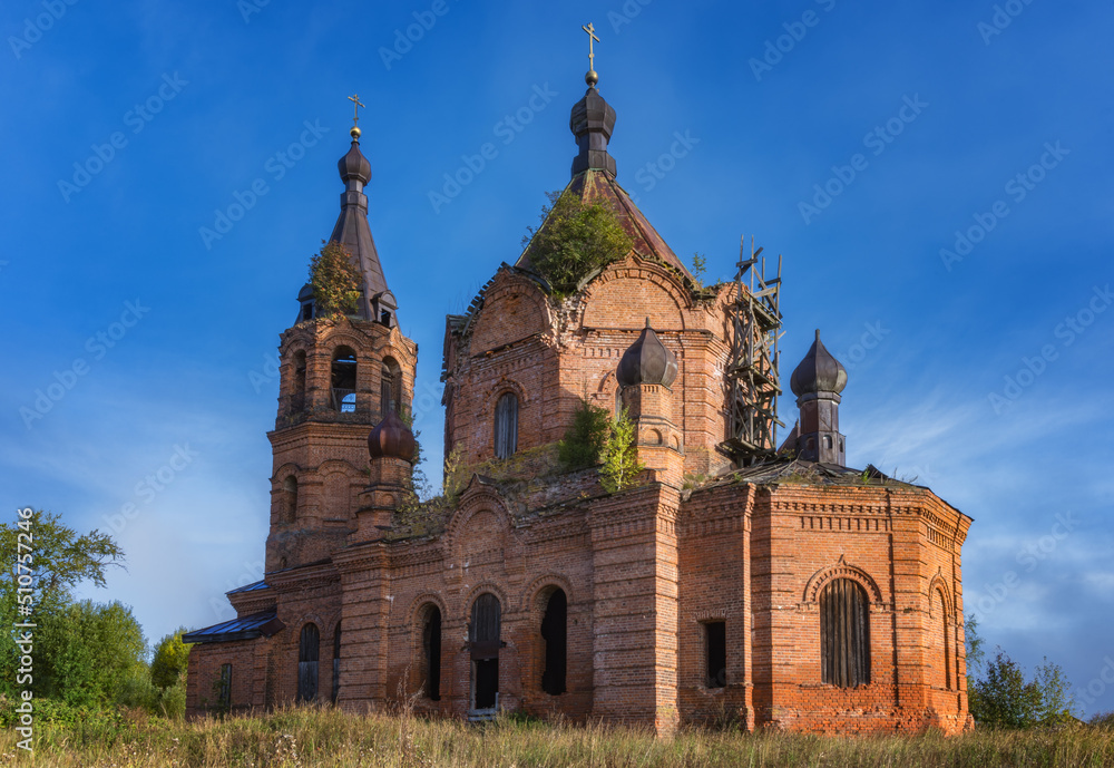 Historical half-ruined brick church in ancient village of Kamgort (Northern Urals, Russia)