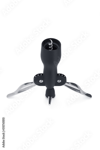 Close-up shot of a black winged corkscrew. This butterfly corkscrew has 2 wings  levers . The winged corkscrew is isolated on a white background. Bottom view.