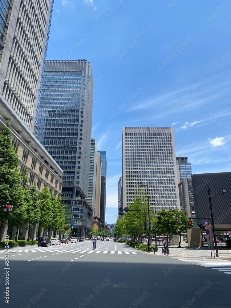 Street pedestrian’s crossings at the Tokyo Station square, city high buildings and the environment, year 2022 June 13th, sunny weekday Japan