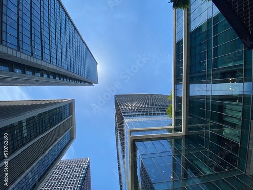 The bright blue sky and the city skyscrapers of Tokyo Marunouchi central downtown, year 2022 June 13th, sunny weekday