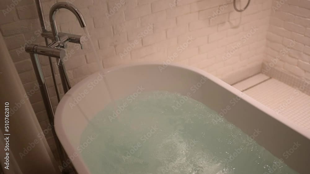 slow motion scene, water flowing in bathtub Stock Video Adobe Stock