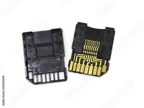 Disassembled micro SD card adapter. Disassembled adapter for a memory card on a white background.