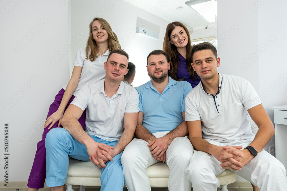 Portrait of five dentist at modern clinic