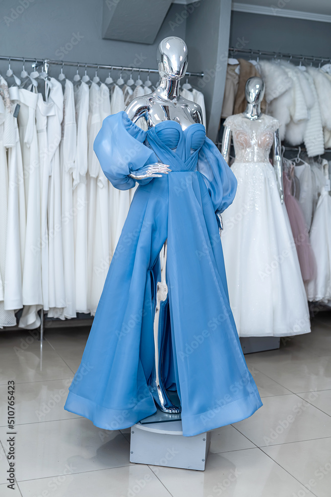 blue evening dress on mannequin for party bridesmaid wedding in bridal shop blue evening dress on mannequin for party bridesmaid wedding in bridal shop