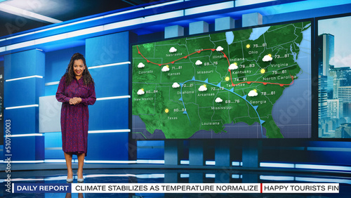 TV Weather Forecast Program: Professional Television Host Reviewing Weather Report in Newsroom Studio, Uses Big Screen with Visuals. Famous Anchorwoman Talks. Mock-up Cable Channel Concept. photo