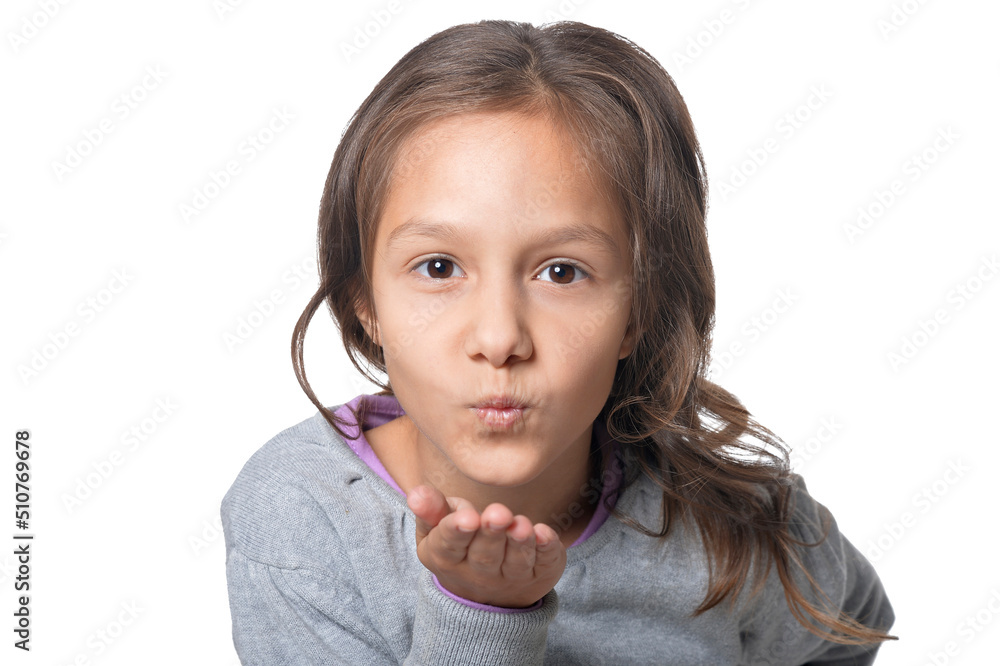 Portrait of cute smiling little girl blowing air kiss on white background Portrait of cute smiling little girl blowing air kiss on white background