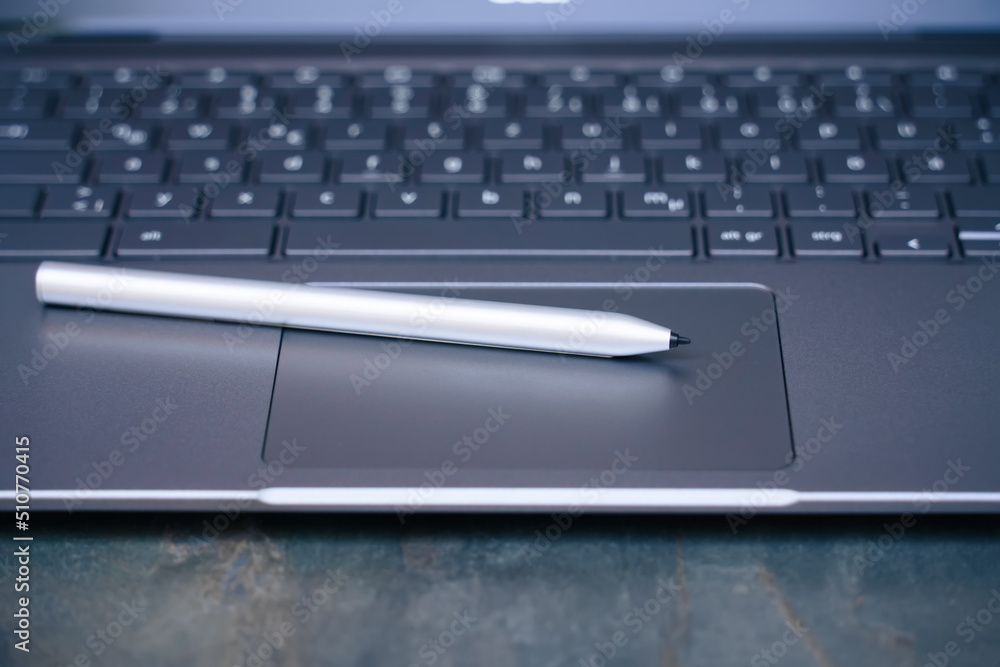 electronic pen on a notebook