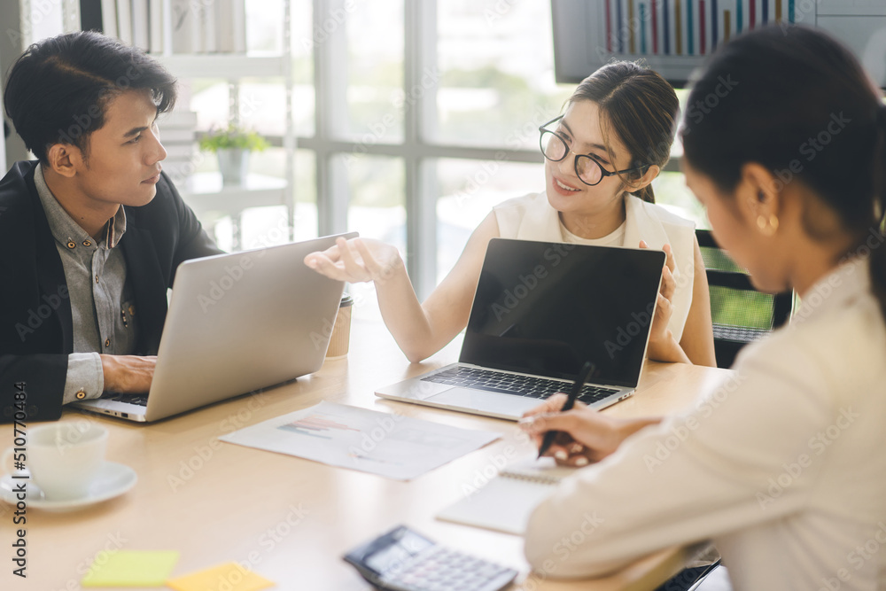 Young adult business woman using laptop presentation data in boardroom workplace Young adult business woman using laptop presentation data in boardroom workplace