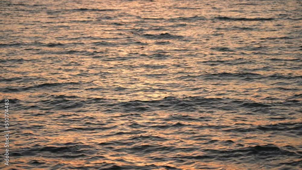 Natural wavy golden sunny sunrise or sunset sea water. Abstract liquid wavy natural 4k stock video background Natural wavy golden sunny sunrise or sunset sea water. Abstract liquid wavy natural 4k stock video background