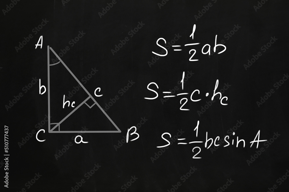 Basic triangle area formulas written on chalkboard Basic triangle area formulas written on chalkboard