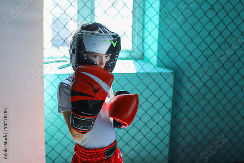 The boy is preparing for a boxing fight, Thai boxing.