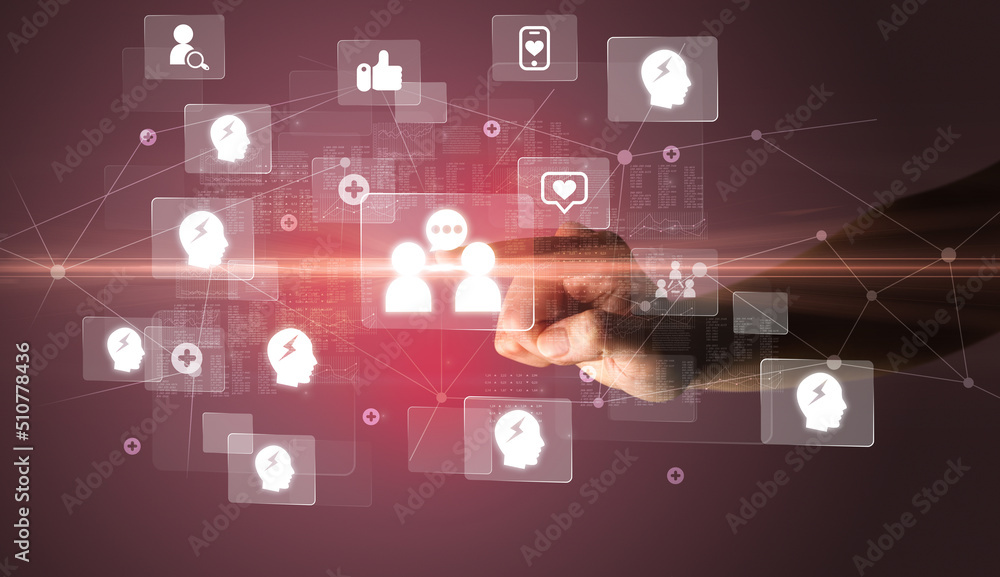 Hand pressing social media multimedia application screen with media icons on futuristic concept Hand pressing social media multimedia application screen with media icons on futuristic concept