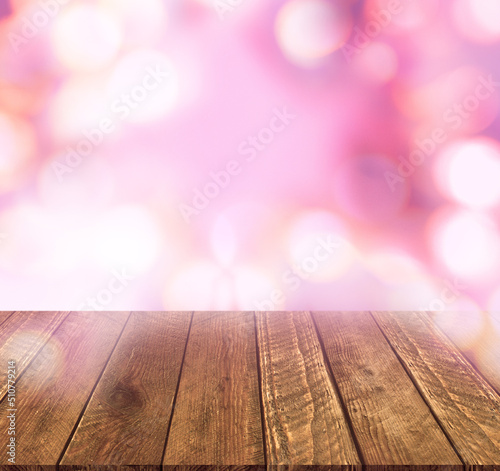 Wood table top on pink bokeh abstract background