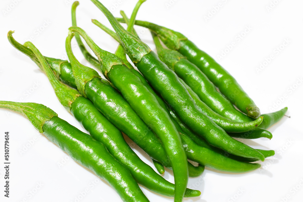 Fresh green chilli peppers isolated on white background Fresh green chilli peppers isolated on white background