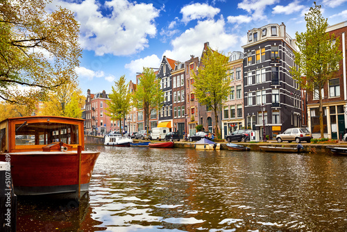 Channel in Amsterdam Netherlands houses river Amstel landmark old european city spring landscape. #510780489
