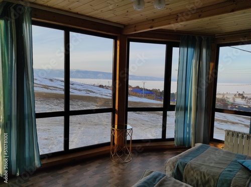 large square windows in the room with curtains