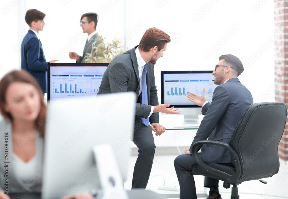 Group of business partners interacting during break Group of business partners interacting during break