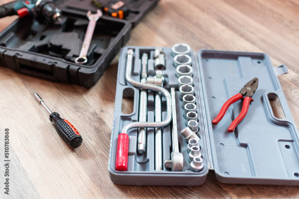 Fototapeta premium Box with electrician tools on wooden background.
