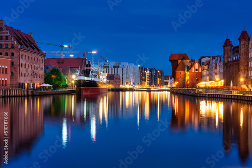 Beautiful Gdansk city reflected in the Motlawa River at dusk. Poland