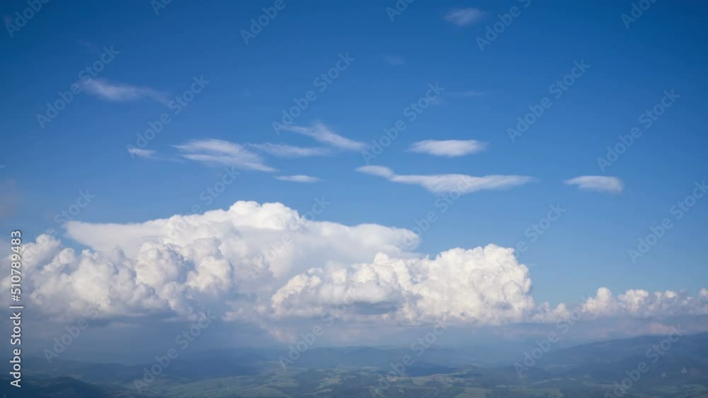 The birth and movement of cumulus clouds over the tops of mountains. The birth and movement of cumulus clouds over the tops of mountains.