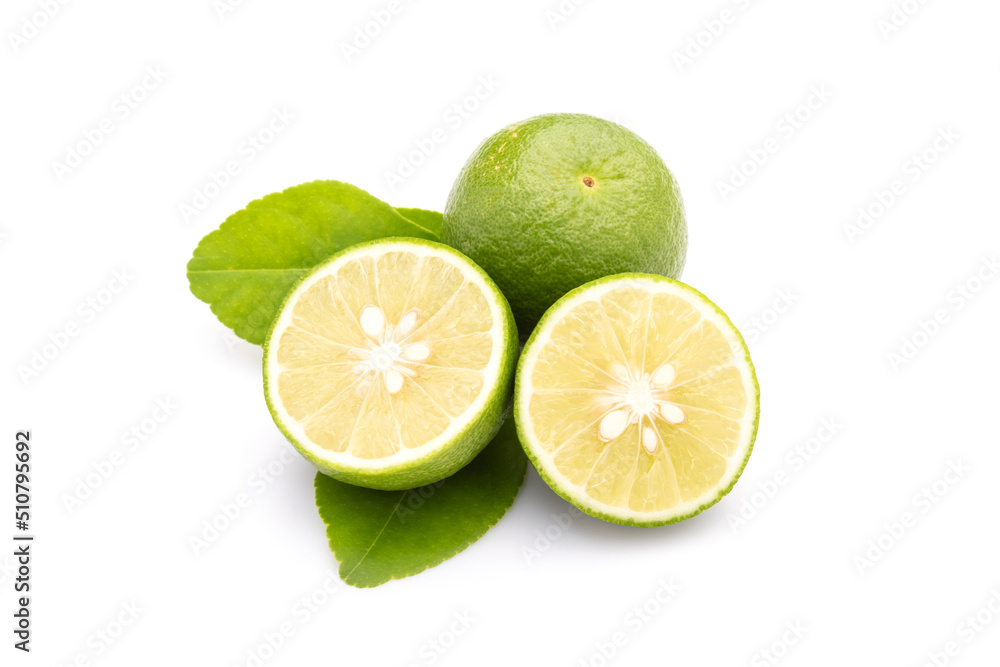 Slice of Thai Lime (Common Lime) or local lime isolated on white background. Food and healthcare concept
