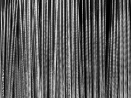 closeup of long threaded steel bars