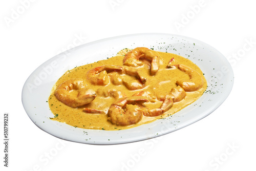 White plate with baked shrimps and curry sausage Isolated
