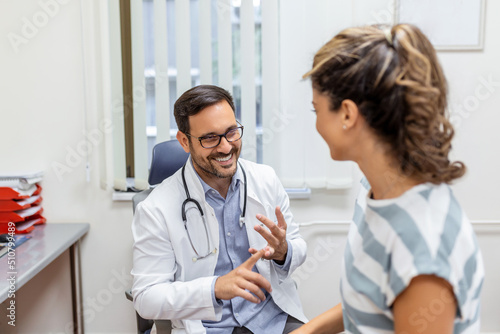 Young male professional doctor physician consulting patient  talking to adult woman client at medical checkup visit. diseases treatment. medical health care concept