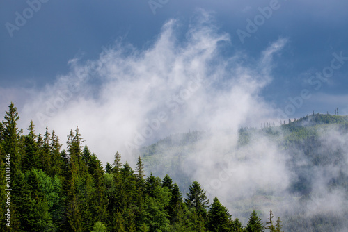 Landscape with steam rising from the mountains