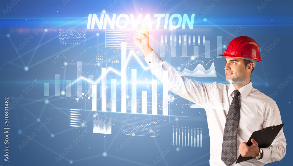 Young businessman with helmet drawing on virutal screen Young businessman with helmet drawing on virutal screen
